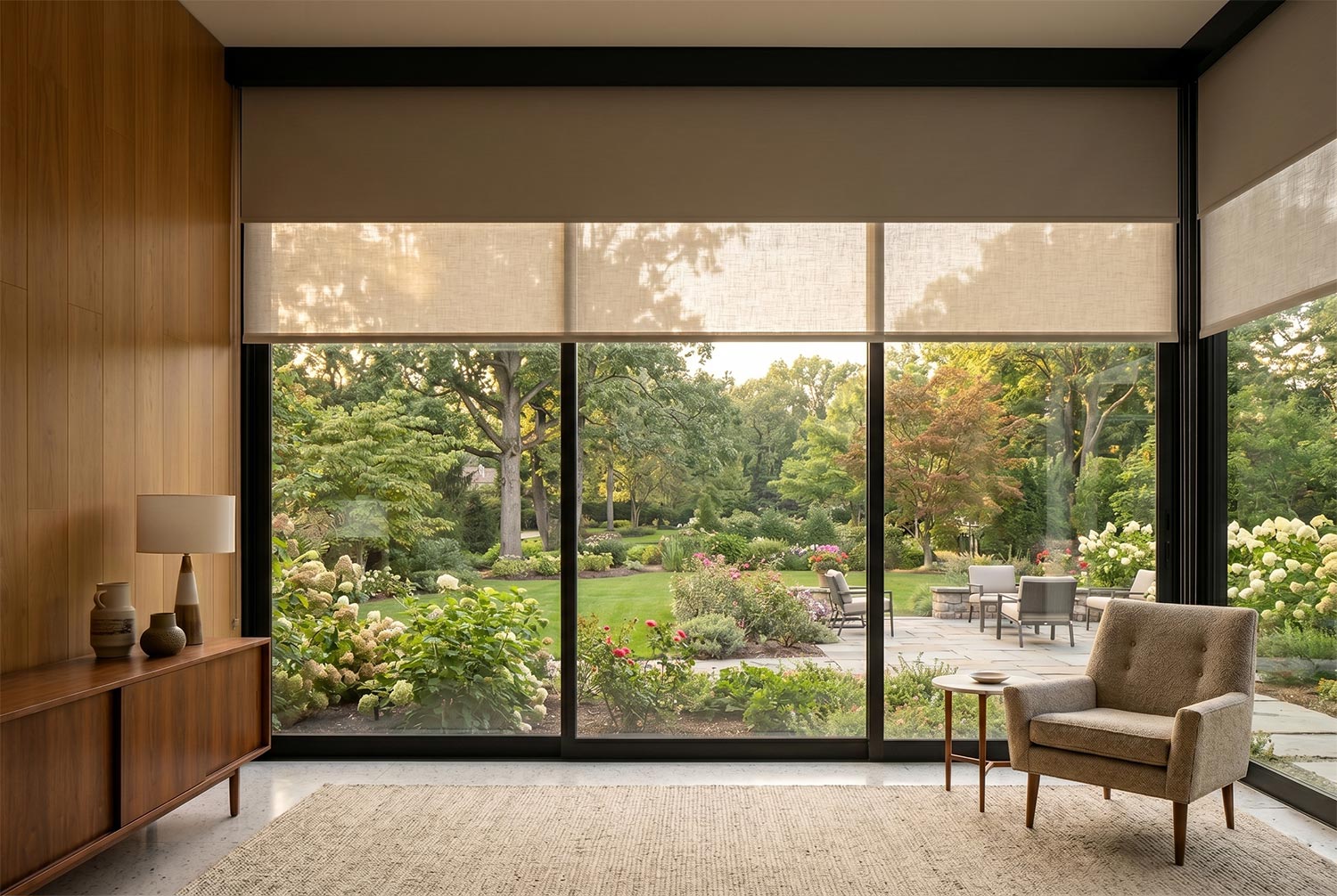 Blackout shades partially lowered over a window in suburban Atlanta